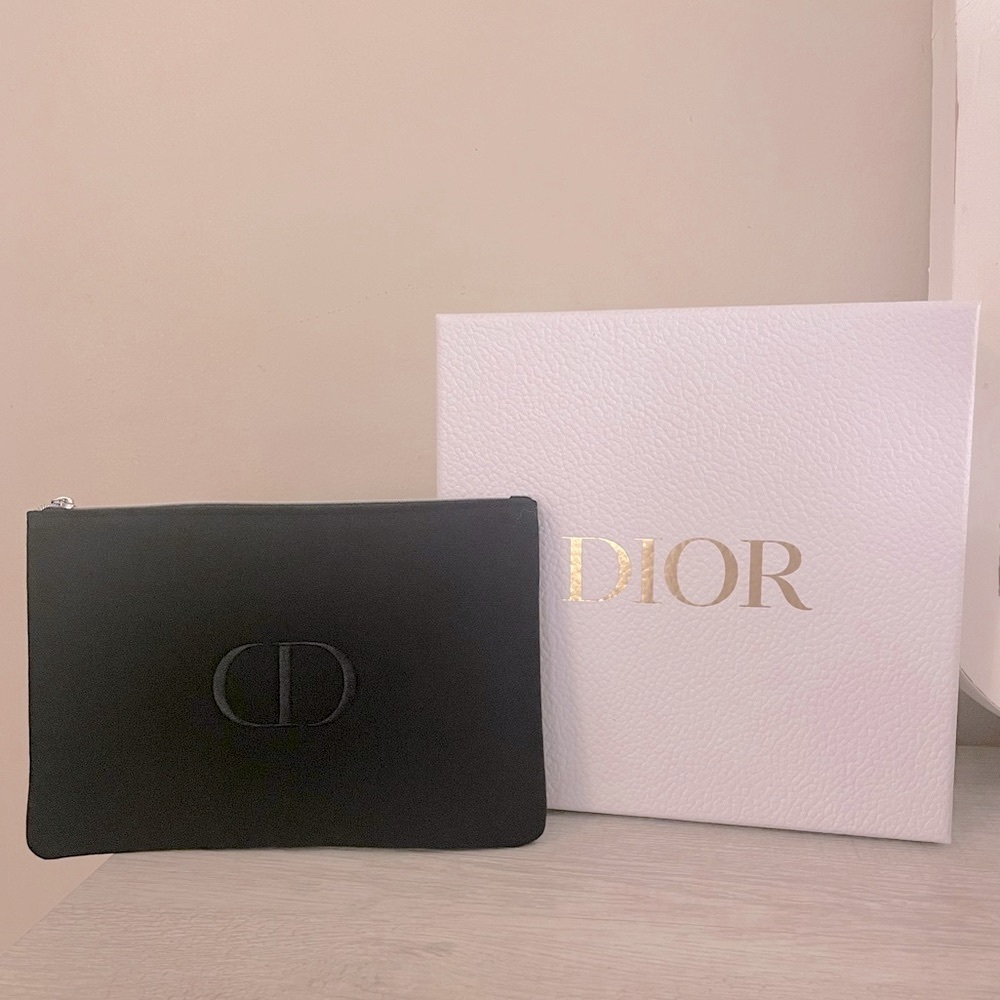 Authentic Dior flat pouch in Black. New. Comes with box.